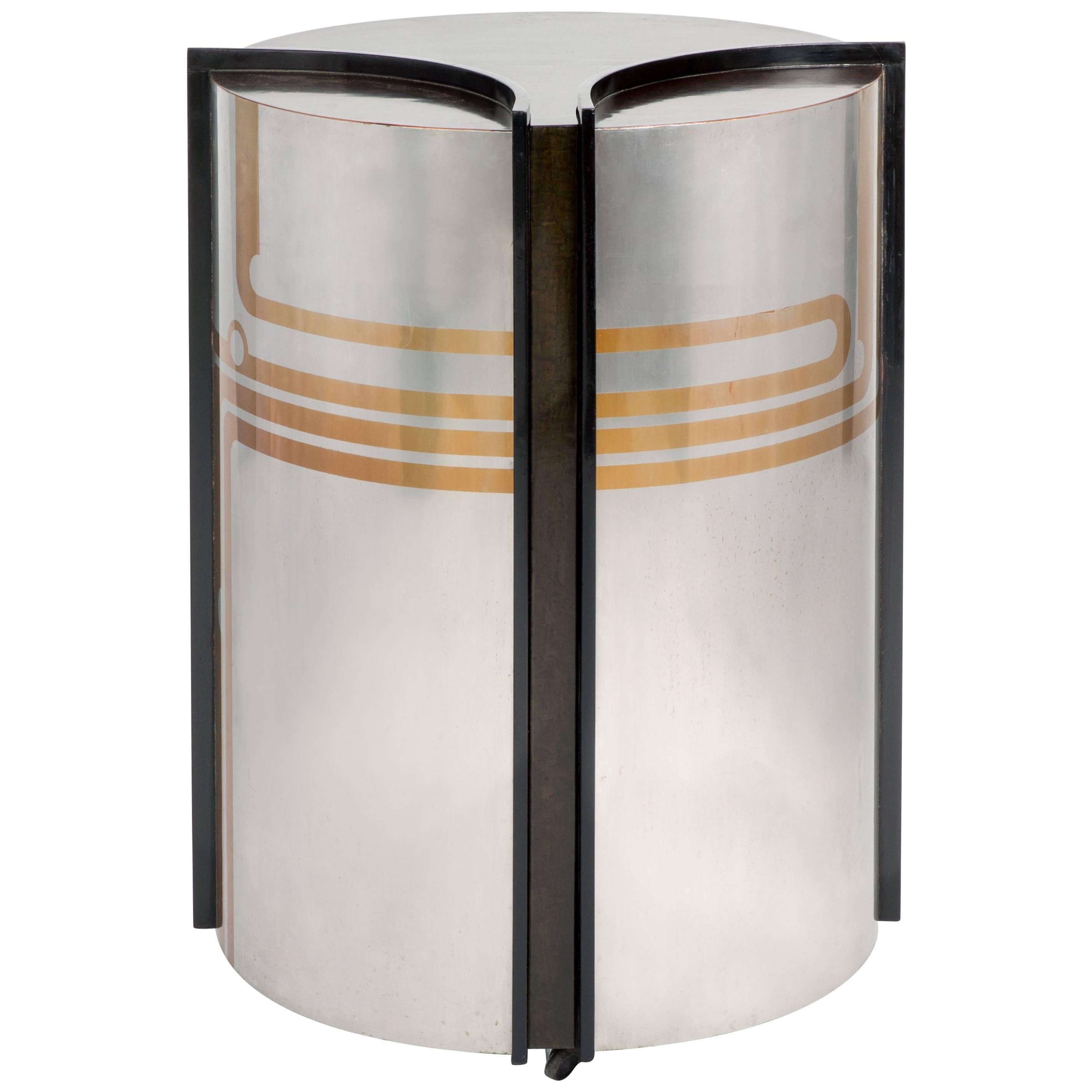Pierre Cardin is an Italian-born French fashion designer known for avant-garde and Space Age designs, as demonstrated by this bar cabinet. 

Signed by Pierre Cardin on an interior plaque. The inside has one shelf in the main body of the piece and