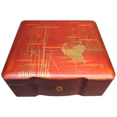 Japanese Burnt Orange Lacquered Box with Gold Painted Cranes