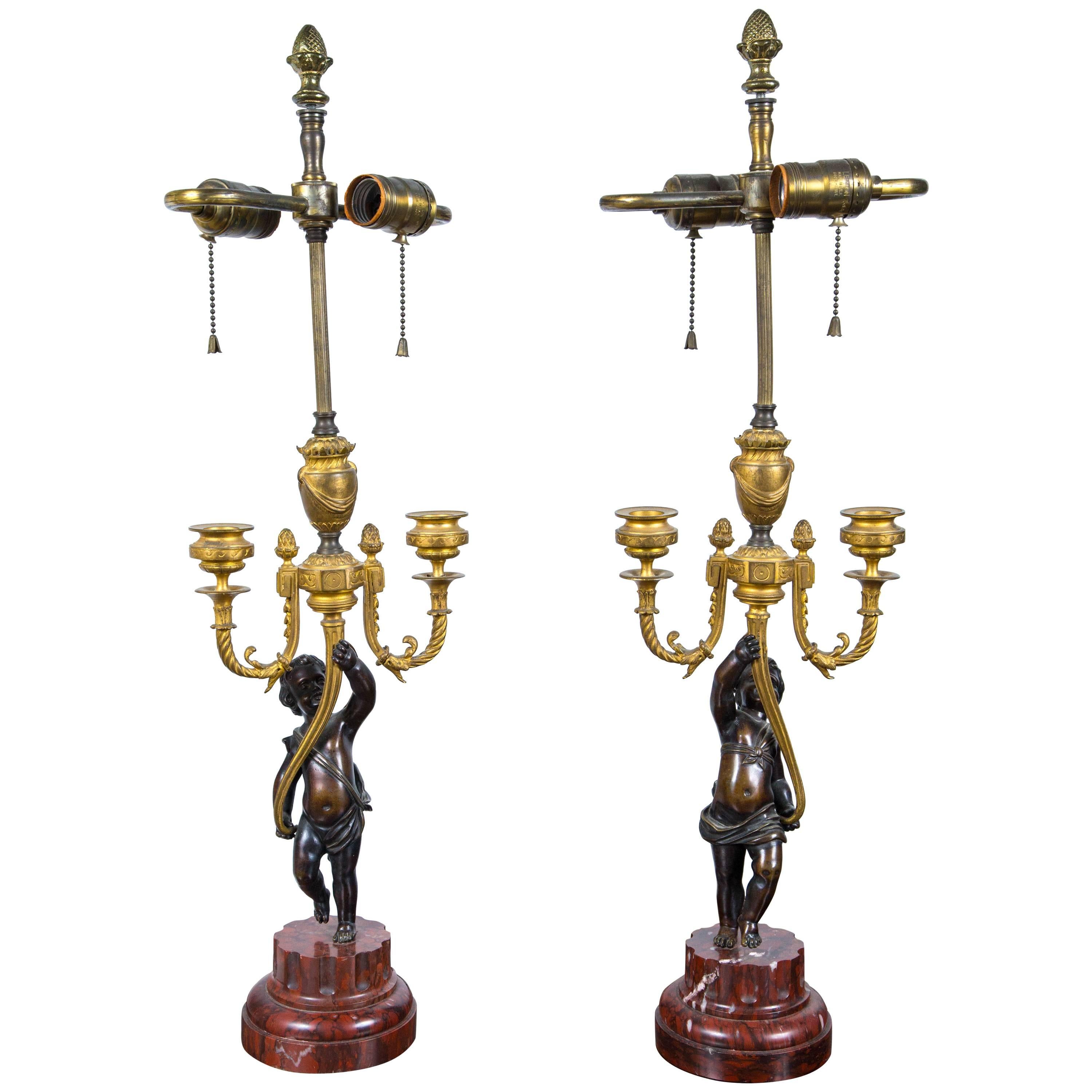 Pair of Antique Gilt and Patinated Bronze Putti Candelabra For Sale