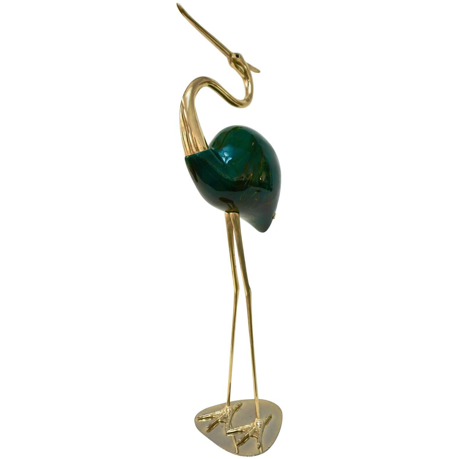 Rare organic sculptural work signed by the Italian architect Alessandro Petti, 1960s, in brass with hand-carved wood body decorated and hand enameled in trompe-l'oeil to resemble green agate.
Can be complemented with a smaller flamingo bird, our
