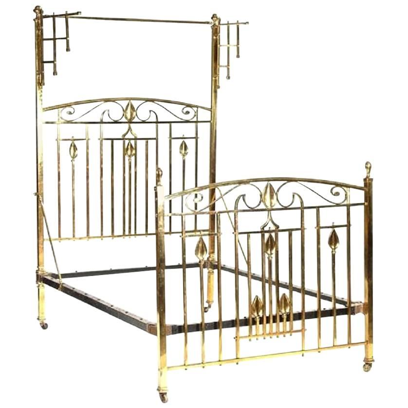 An Arts & Crafts Cast Brass Half Tester Double Bed with Stylised Floral Details