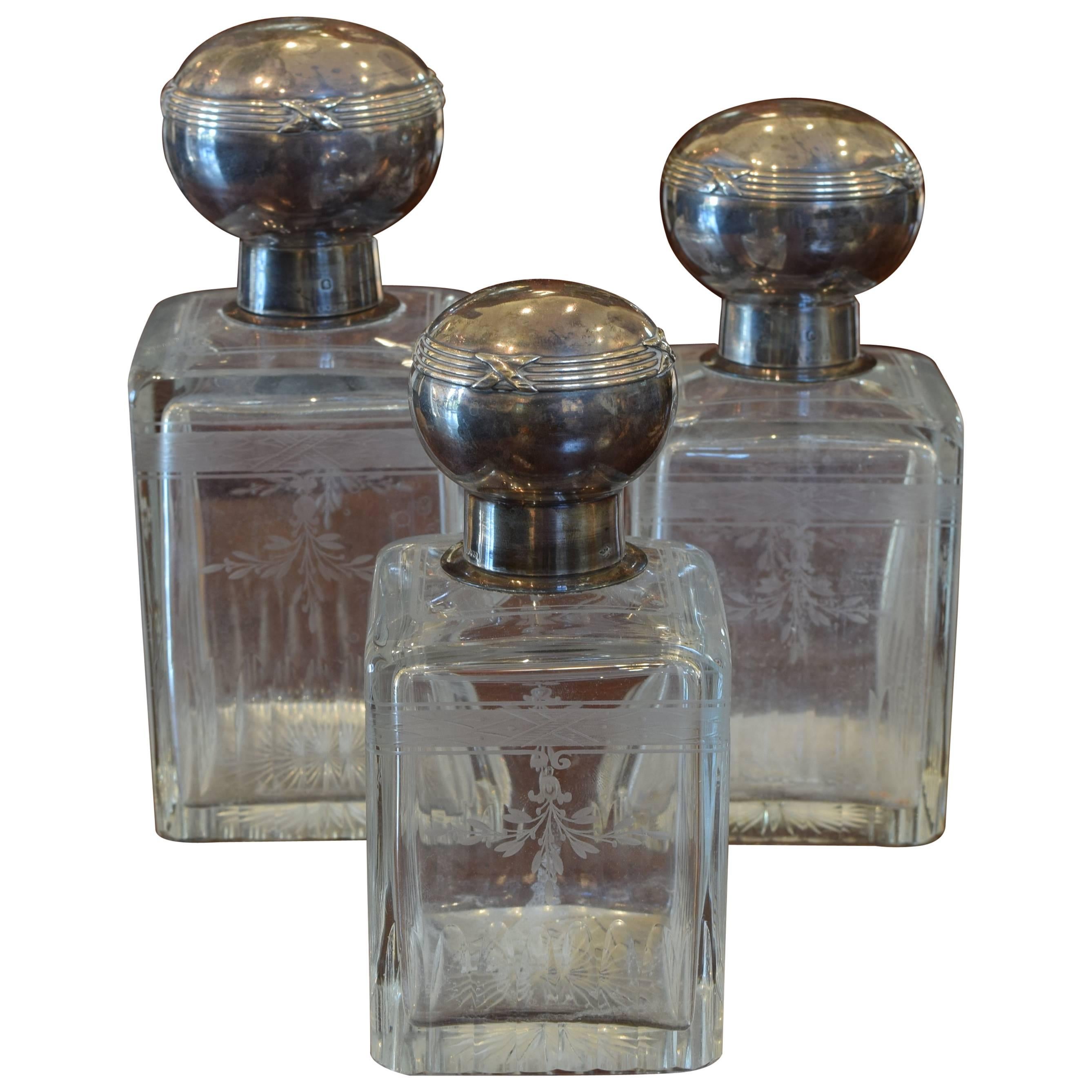 Set of Three Cut & Etched Glass Decanters with Sterling Silver Tops, circa 1900 For Sale