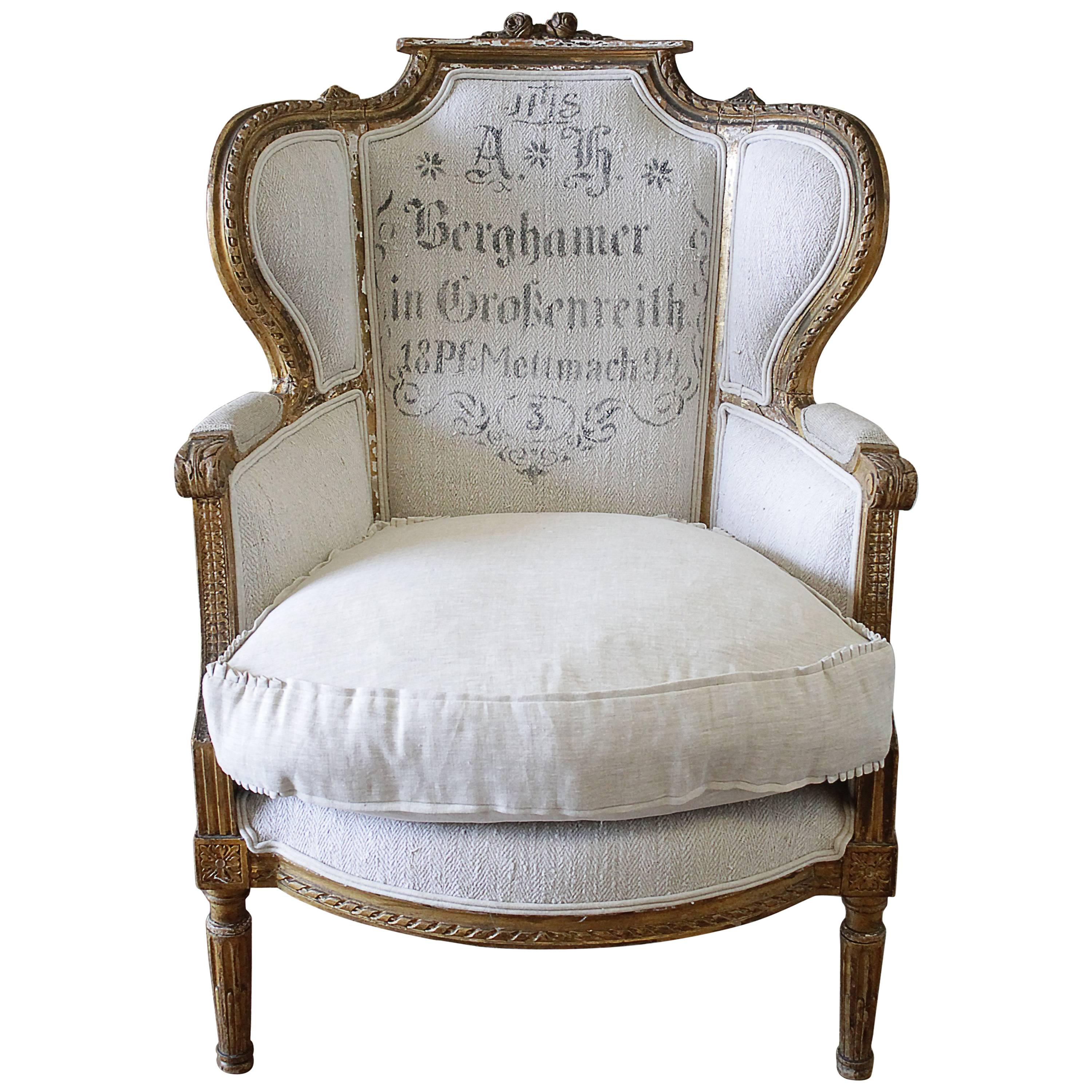 Antique French Louis XVI Style Wing Chair in Antique Grain Sack Upholstery