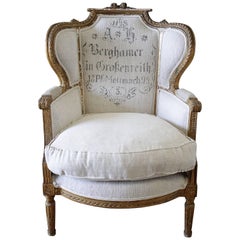 Antique French Louis XVI Style Wing Chair in Antique Grain Sack Upholstery
