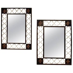 Pair of Ebonised and Gilded Metal Mirrors