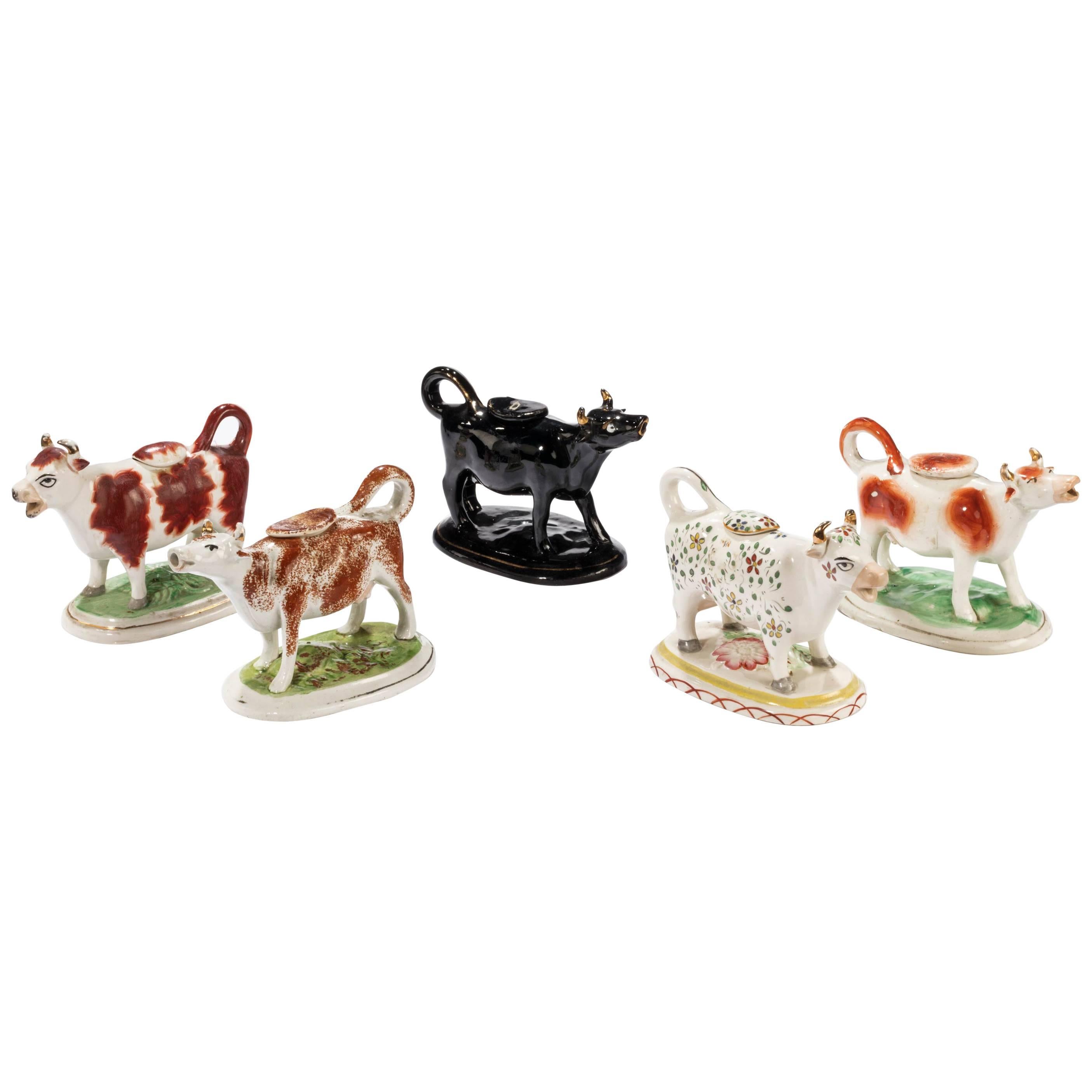 Collection of Five 20th Century Cow Creamers