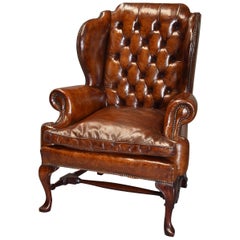 Early 20th Century Georgian Style Deep Buttoned Brown Leather Wing Armchair
