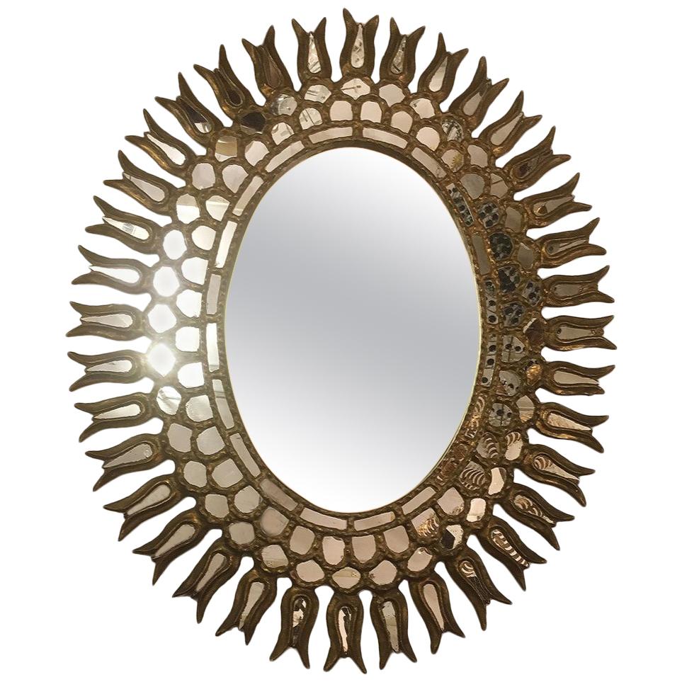 Miroir ovale Sunburst avec motif de feuillage en vente