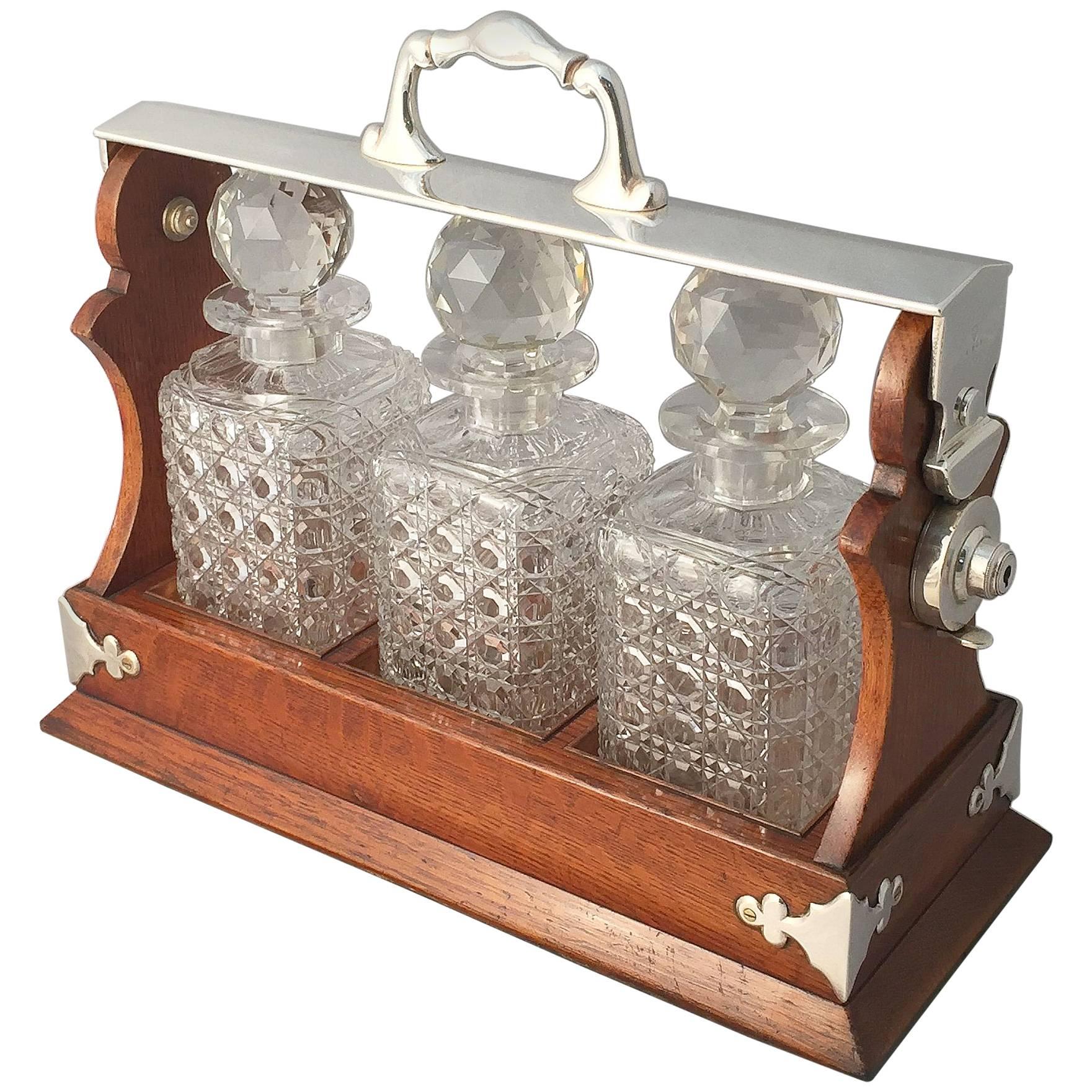 English Tantalus or Decanter Set for Spirits of Oak and Silver
