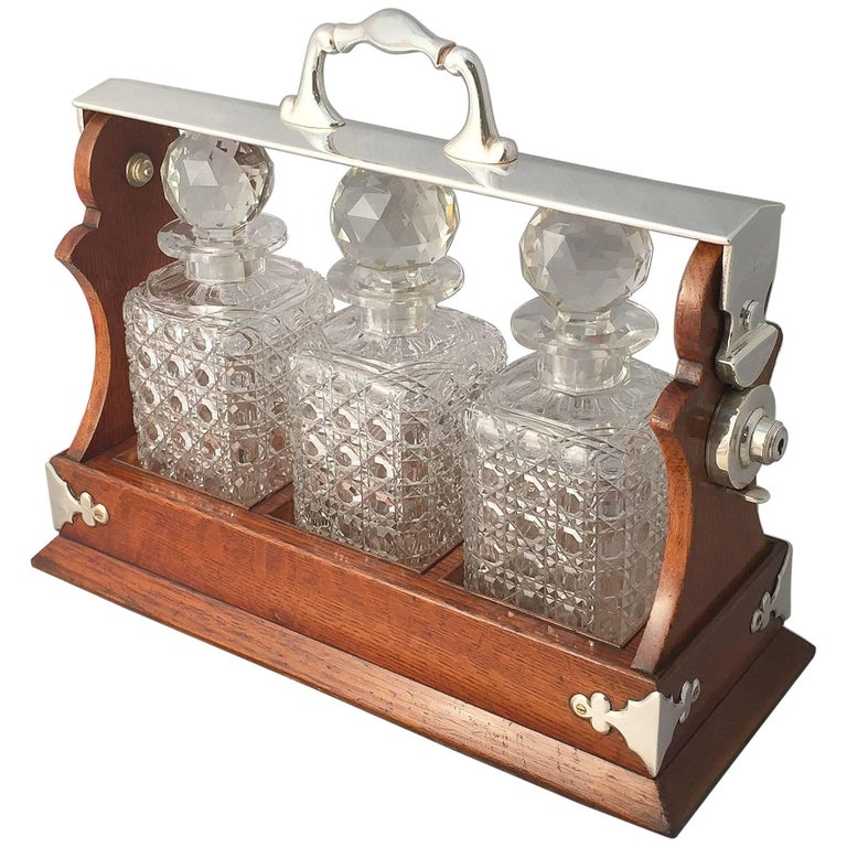 English Tantalus or Decanter Set for Spirits of Oak and Silver at 1stDibs