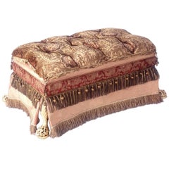 Footed Ottoman, Upholstered in Various Fabrics with Antique Fringe and Trim