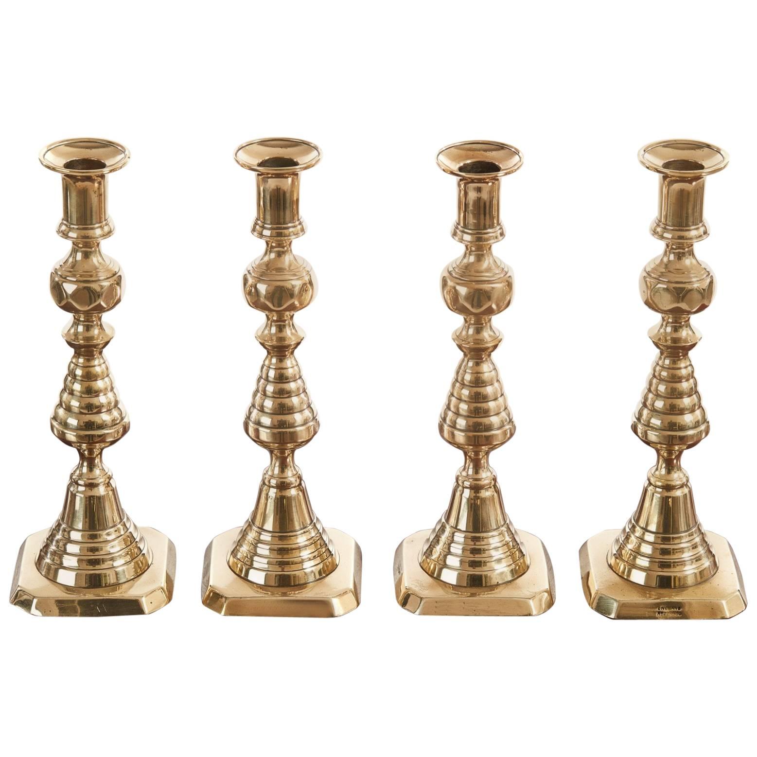 Unusual Set of Four Antique Brass Candlesticks