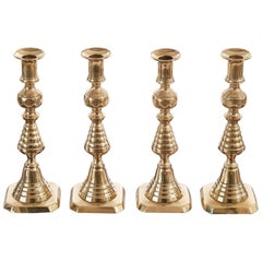 Unusual Set of Four Antique Brass Candlesticks