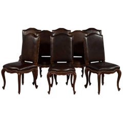 Set of Eight Carved Leather Studded Louis XV Style Dining Chairs