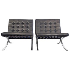 Vintage Pair of Barcelona Black Leather Lounge Chairs by Ludwig Mies van der Rohe