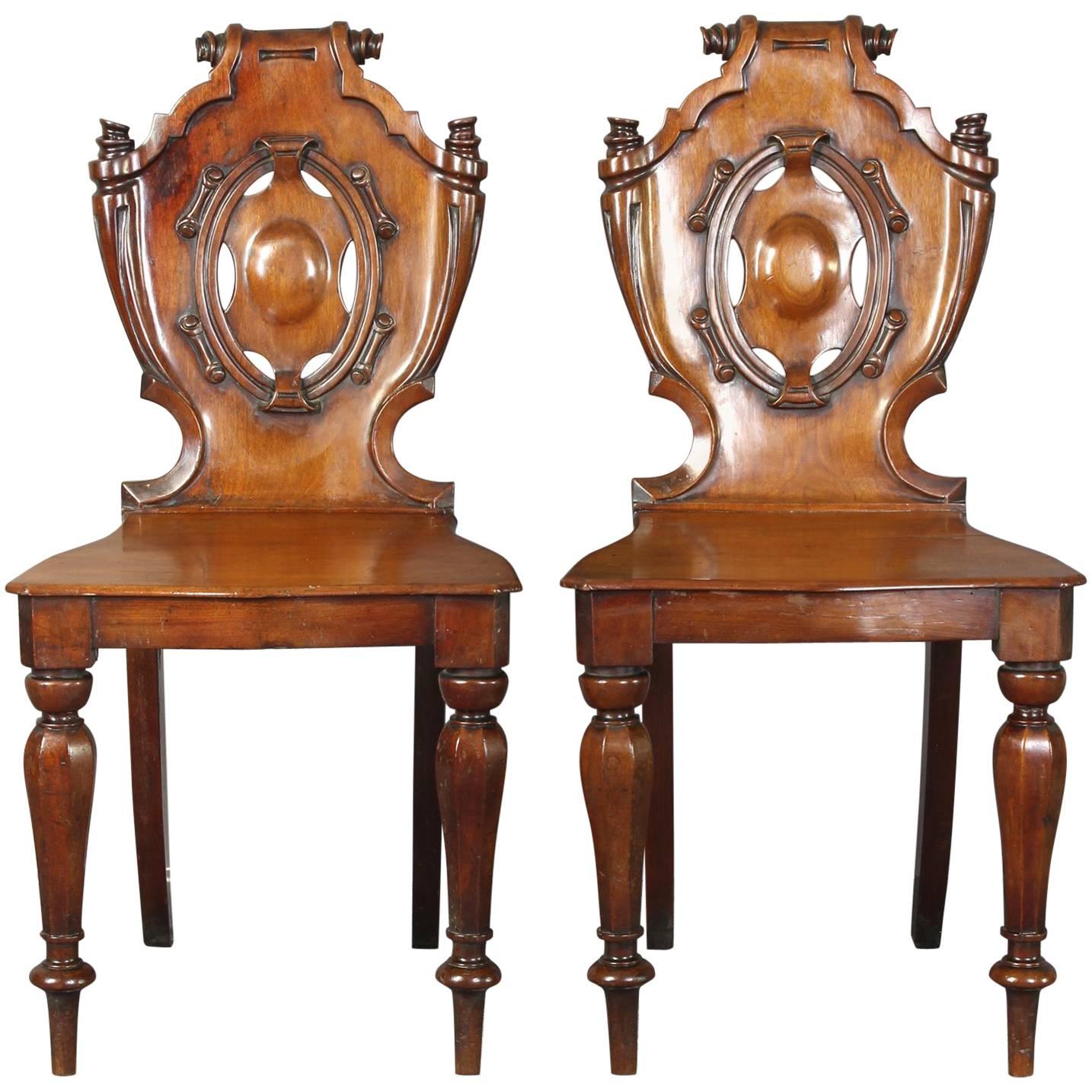 Pair of English William IV Carved Mahogany Hall Chairs