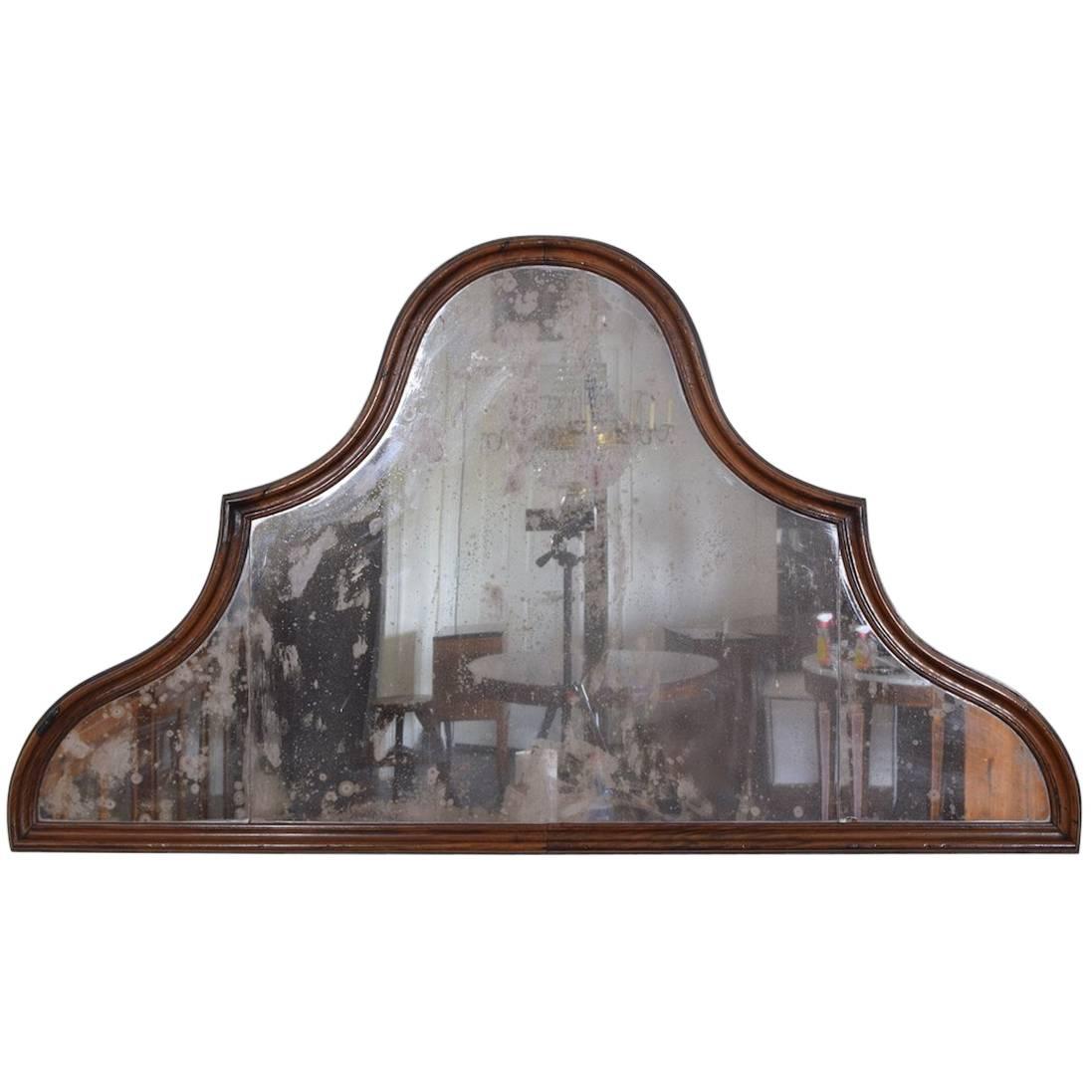 Having an unusual shape and retaining its original three mirror plates, mid-18th century and possibly earlier.