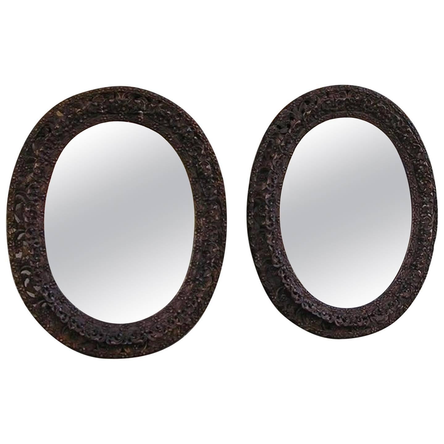 Pair of Anglo-Indian Mahogany Floral Carved Oval Mirrors, Circa 1810 For Sale