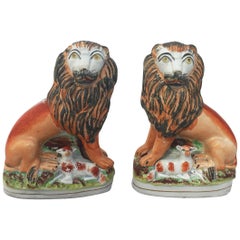 Pair of 19th Century English Staffordshire Lions with Lambs