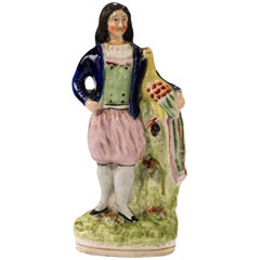 Late 19th Century, Staffordshire Figure of a Young Lady Holding a Peacock