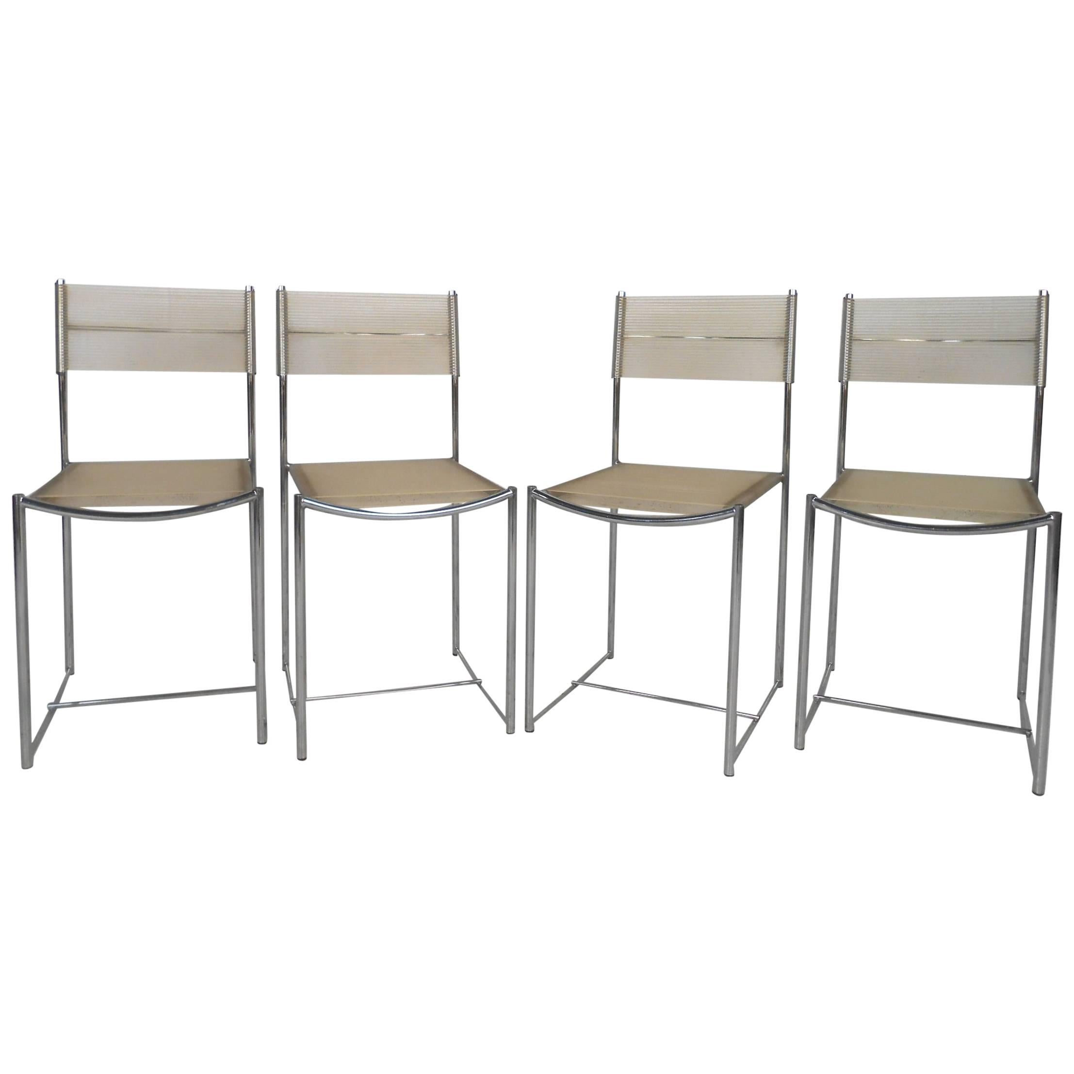 Amazing Set of Four Chrome and Vinyl Cord Dining Chairs