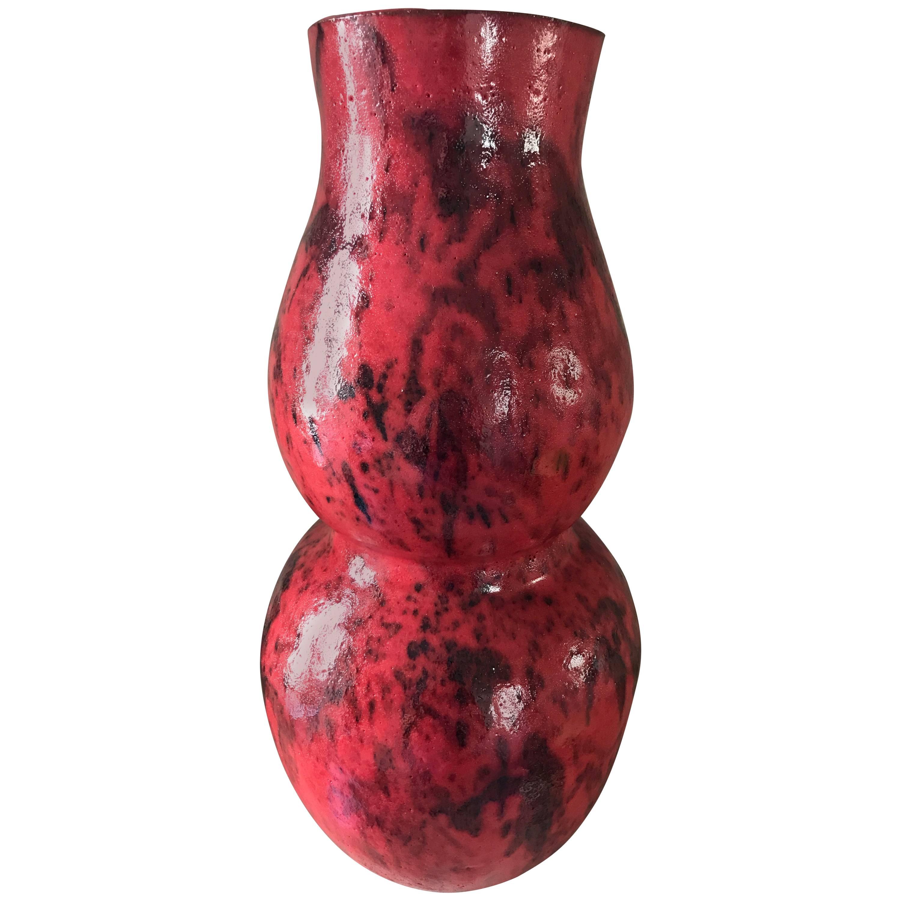 One striking, stylized, double gourd, handmade ceramic vase in a custom vibrant red and speckled black glaze, wired as a lamp base with an on/off switch on wire. Edison base socket.
This contemporary lamp has been custom designed and makes a