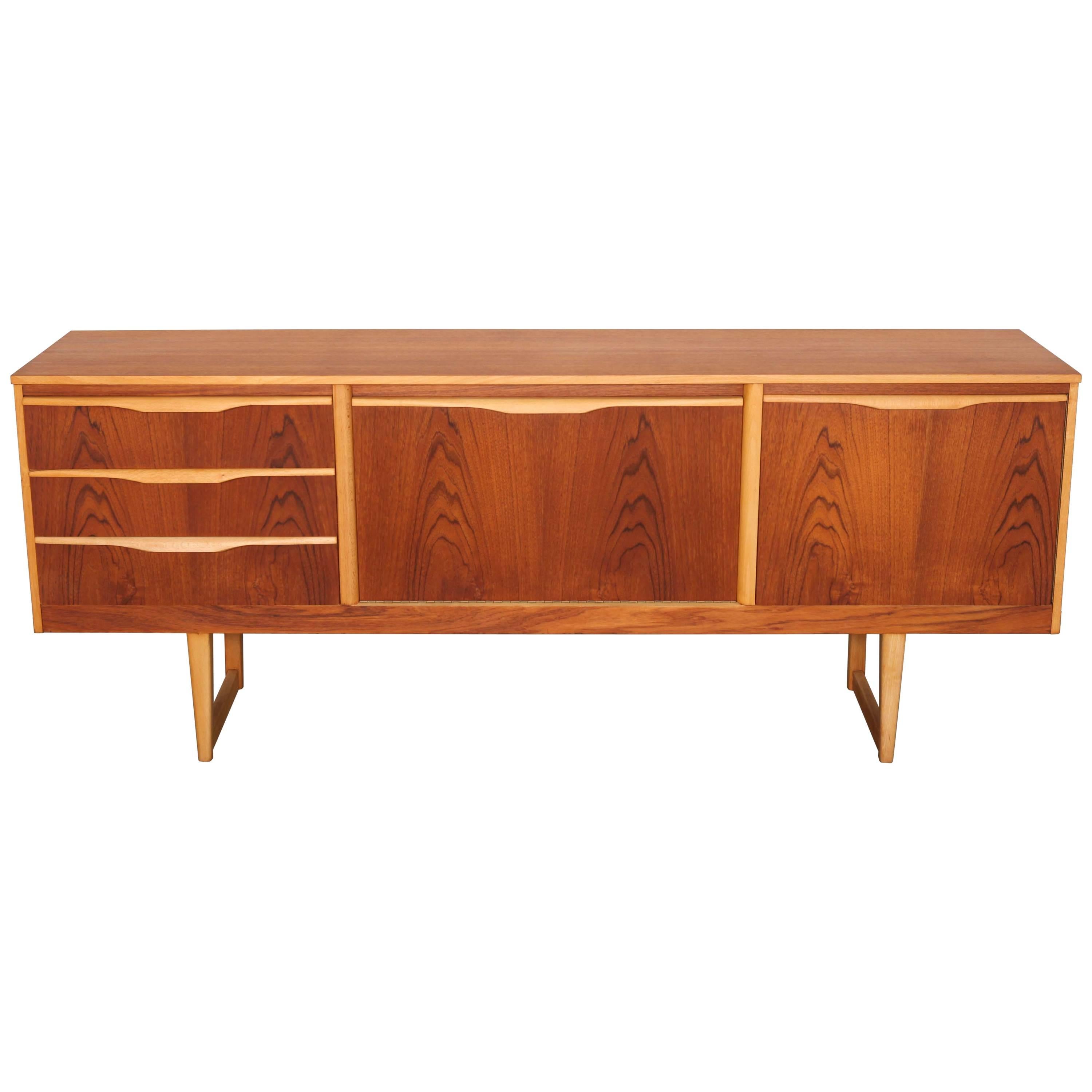 English Mid-Century Modern Three-Drawer Teak Sideboard with Contrasting Handles