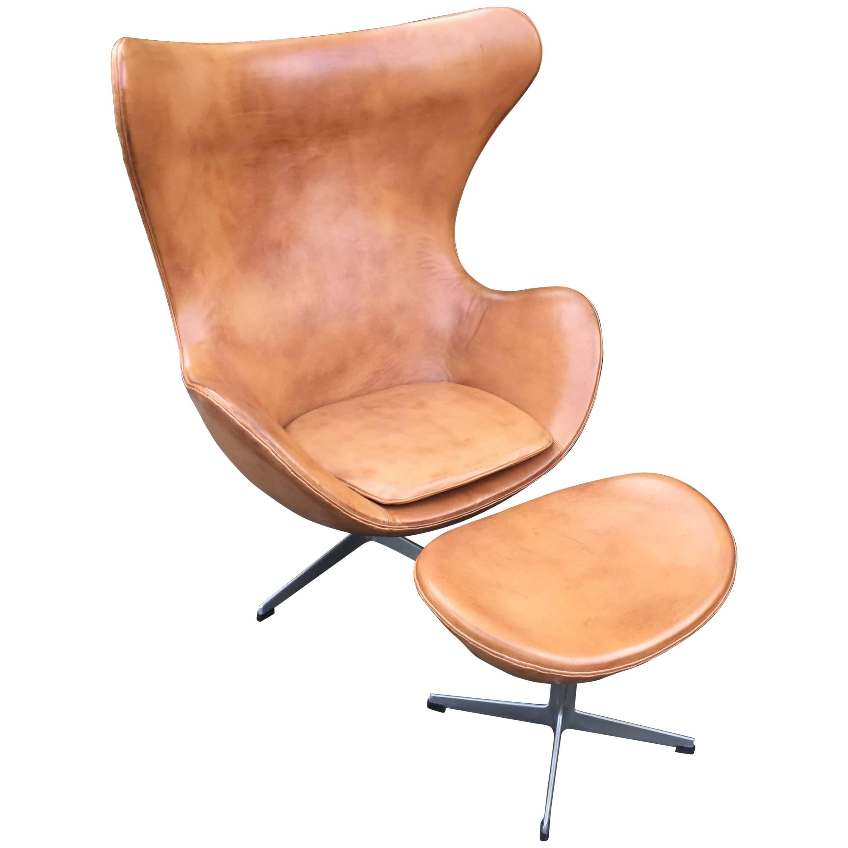 Cognac Leather Egg Chair and Footstool by Arne Jacobsen for Fritz Hansen