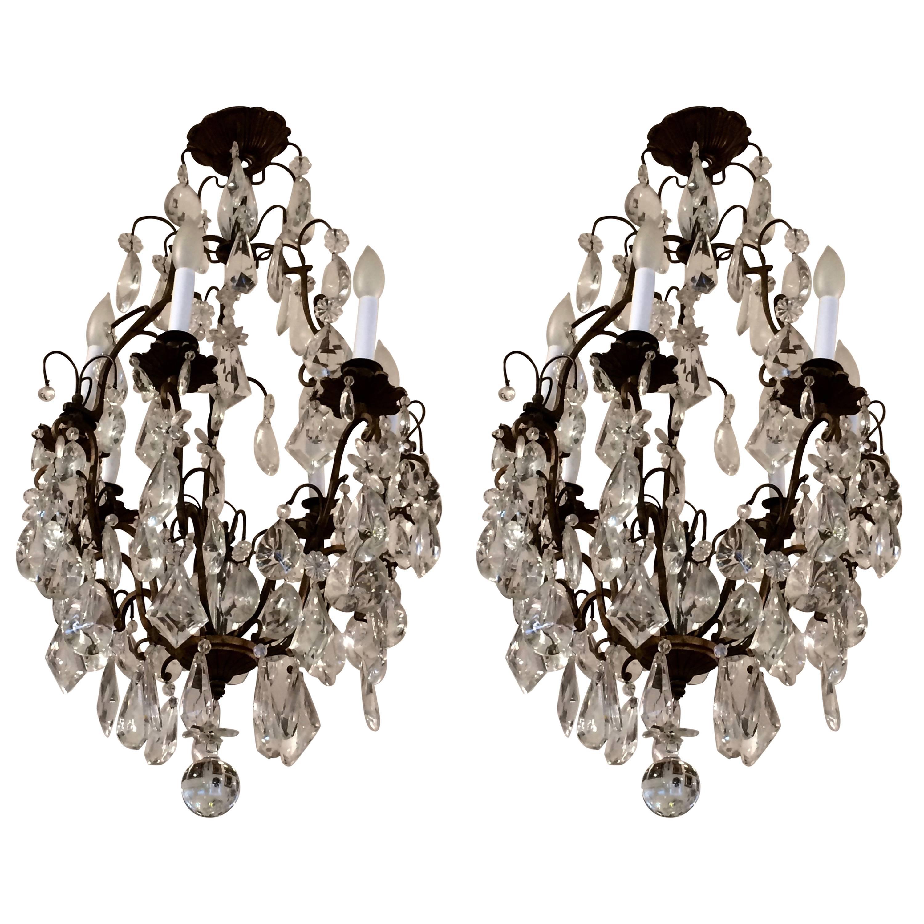 Matching Pair of Glitzy French Gilt Metal and Cut Glass Chandeliers