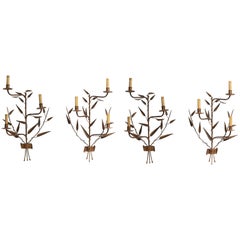 Four Forged and Gilded Iron Sconces