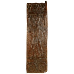 Vintage African Wooden Granary Door with Carved Motifs and Sculls