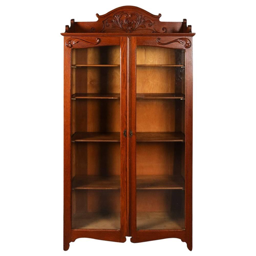 Antique Carved Oak Two-Door Bookcase with Acanthus and Scroll Decoration