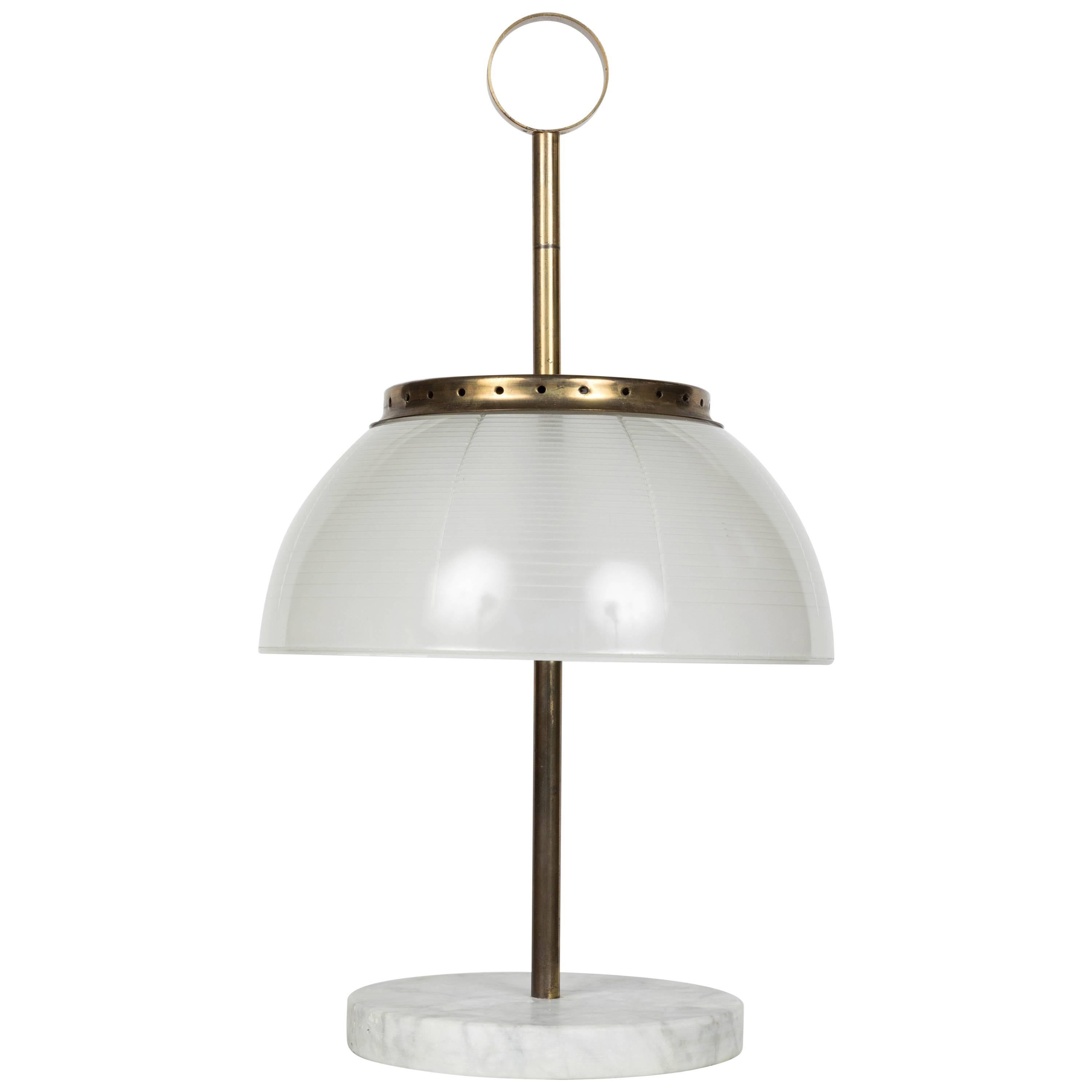 Rare 1960s Sergio Mazza brass and marble table lamp for Artemide. One of the very first Artemide designs, this definitive Sergio Mazza design is executed in pressed glass, patinated brass and luxurious marble. 

Born in Italy in 1931, Sergio Mazza