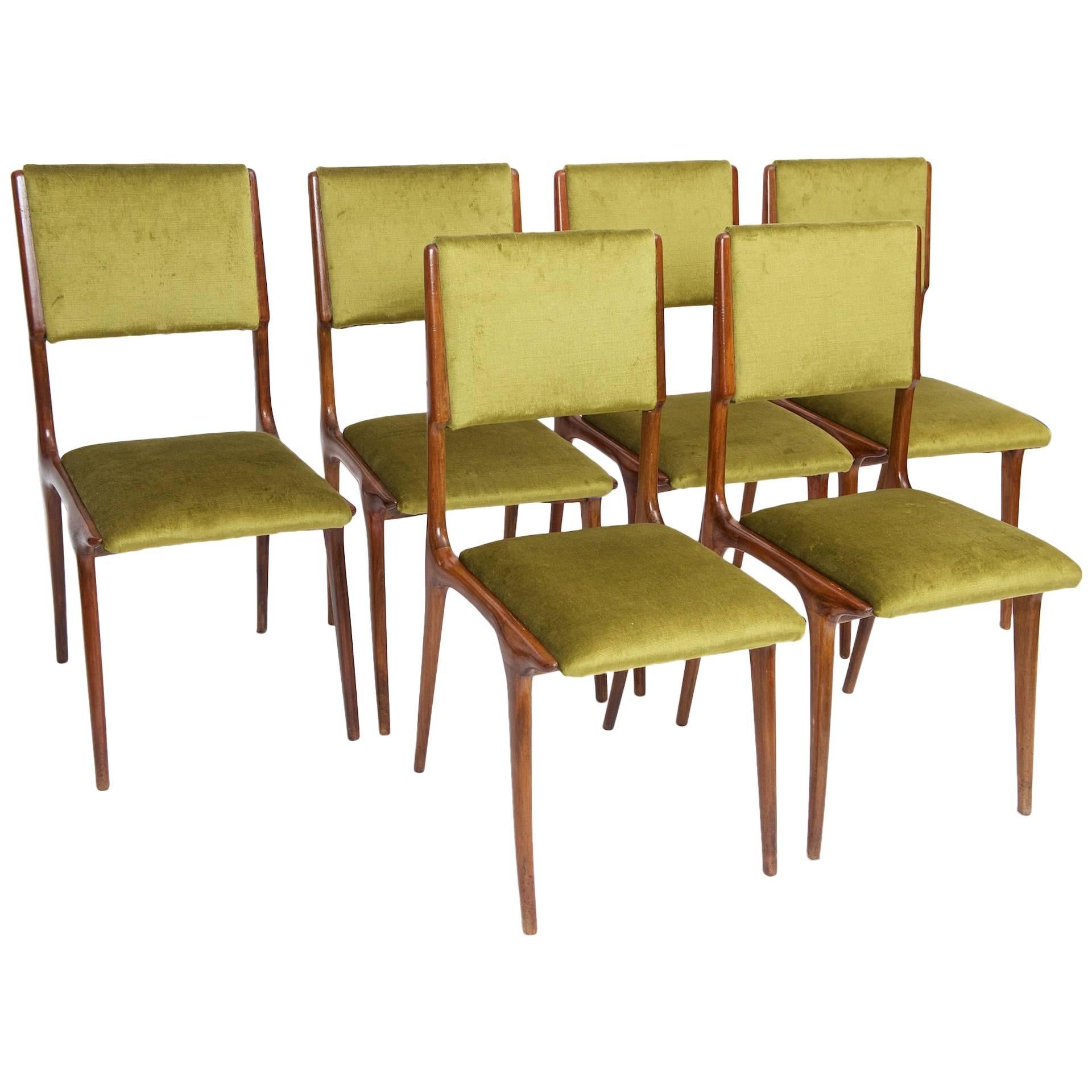 Six Carlo De Carli dining chairs.

Fruitwood and re upholstered in green velvet.