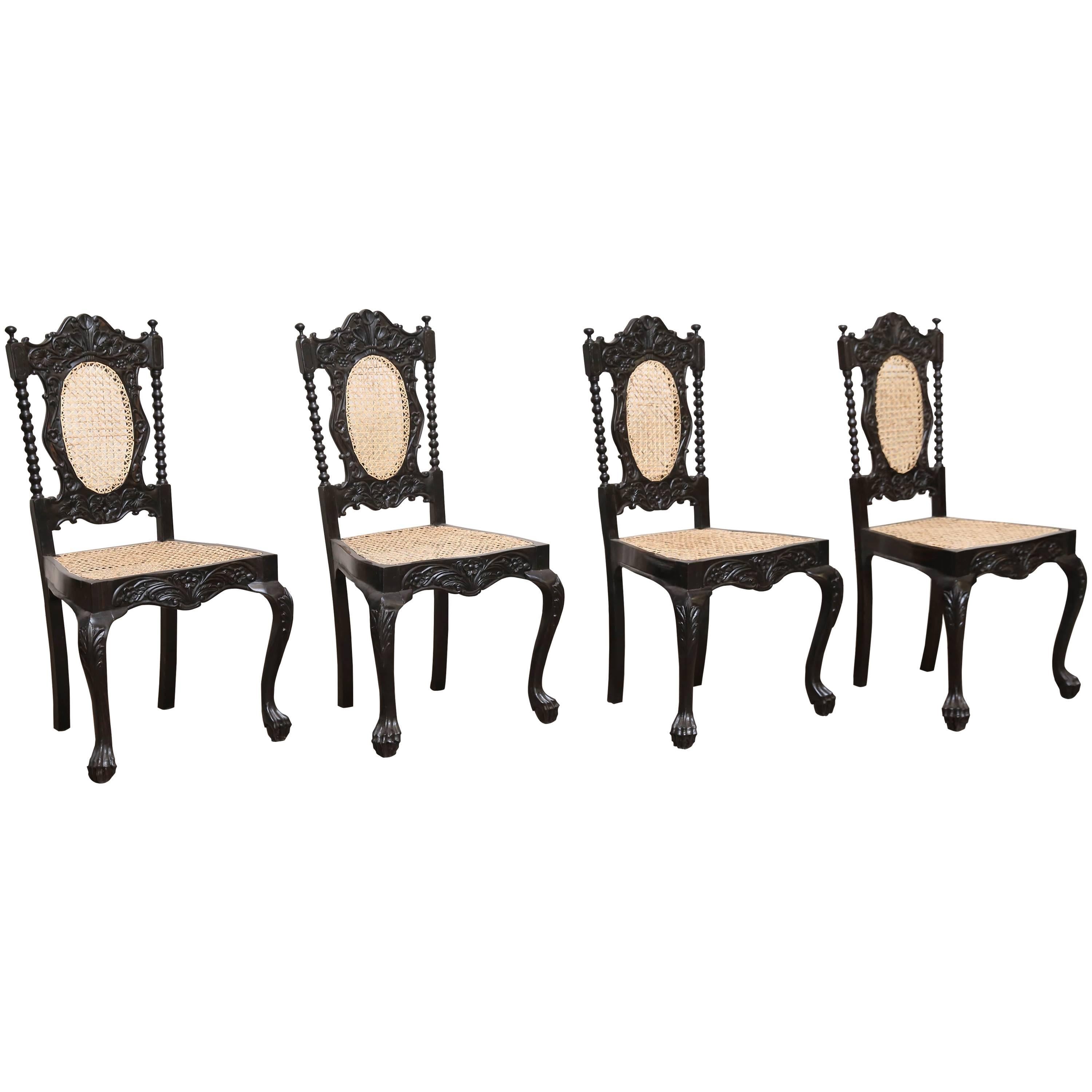 Four Mid-19th Century Exquisitely Carved Solid Ebony and Cane Side Chairs For Sale