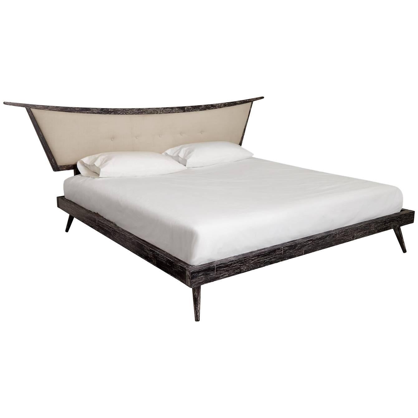 Slumber in gypset glamour with our parker platform bed. The ebonized, cerused frame balances a Mid-Century Modern Silhouette with chinoiserie influences, while the luxe linen headboard offers timeless style. The perfect place to tuck in for the