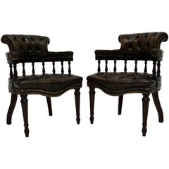 Pair of Distressed Leather and Mahogany Armchairs