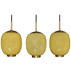 Three Ultra Rare Yellow Stripes Bent Karlby Kina Pendants, Denmark, 1950s