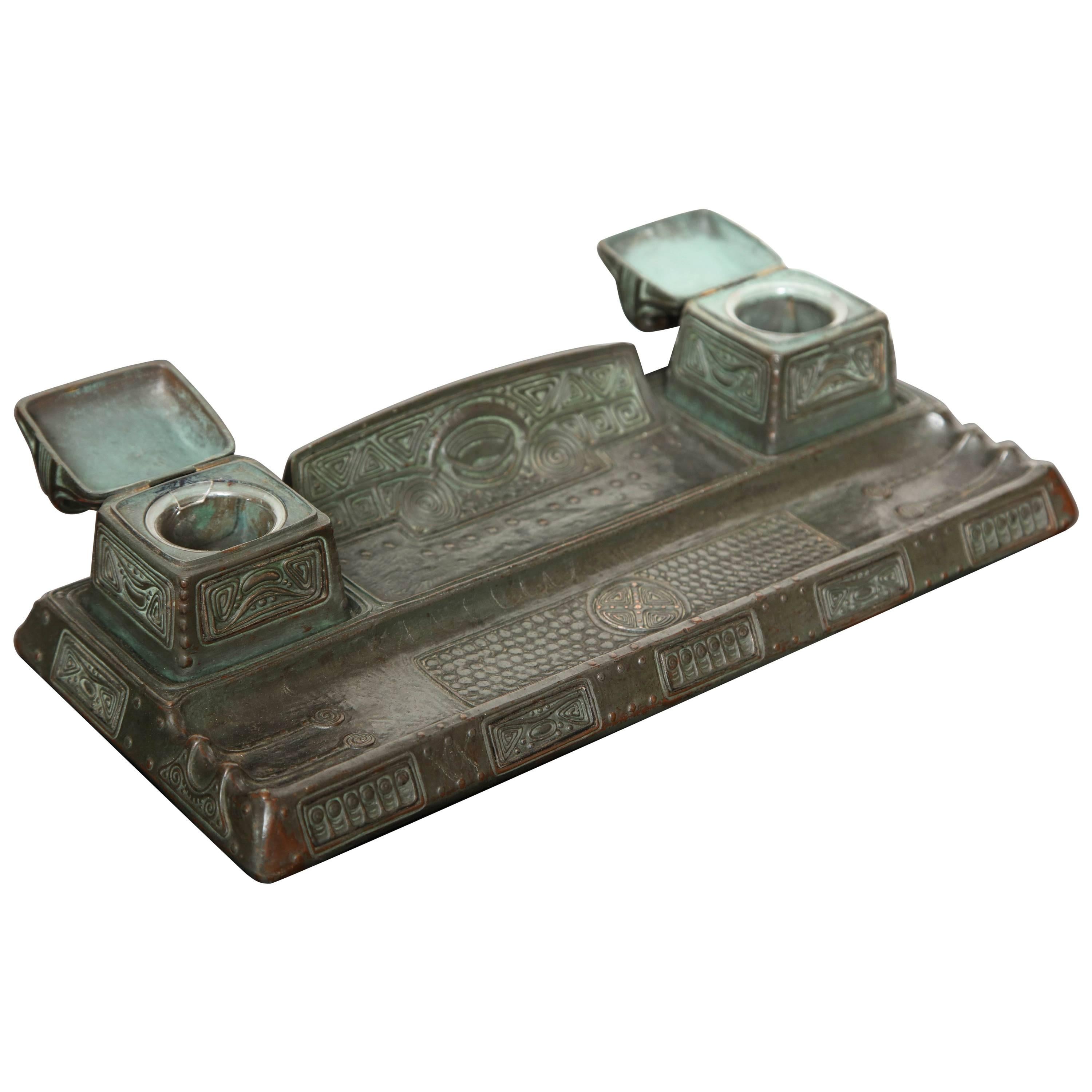 A Gustav Gurschner bronze inkwell/pentray. It was made in Austria during the early 20th century. The side of the inkwell/pentray is signed Gurschner.

Gustav Gurschner (1873–1970) was an Austrian sculptor active in the decorative arts.
He studied