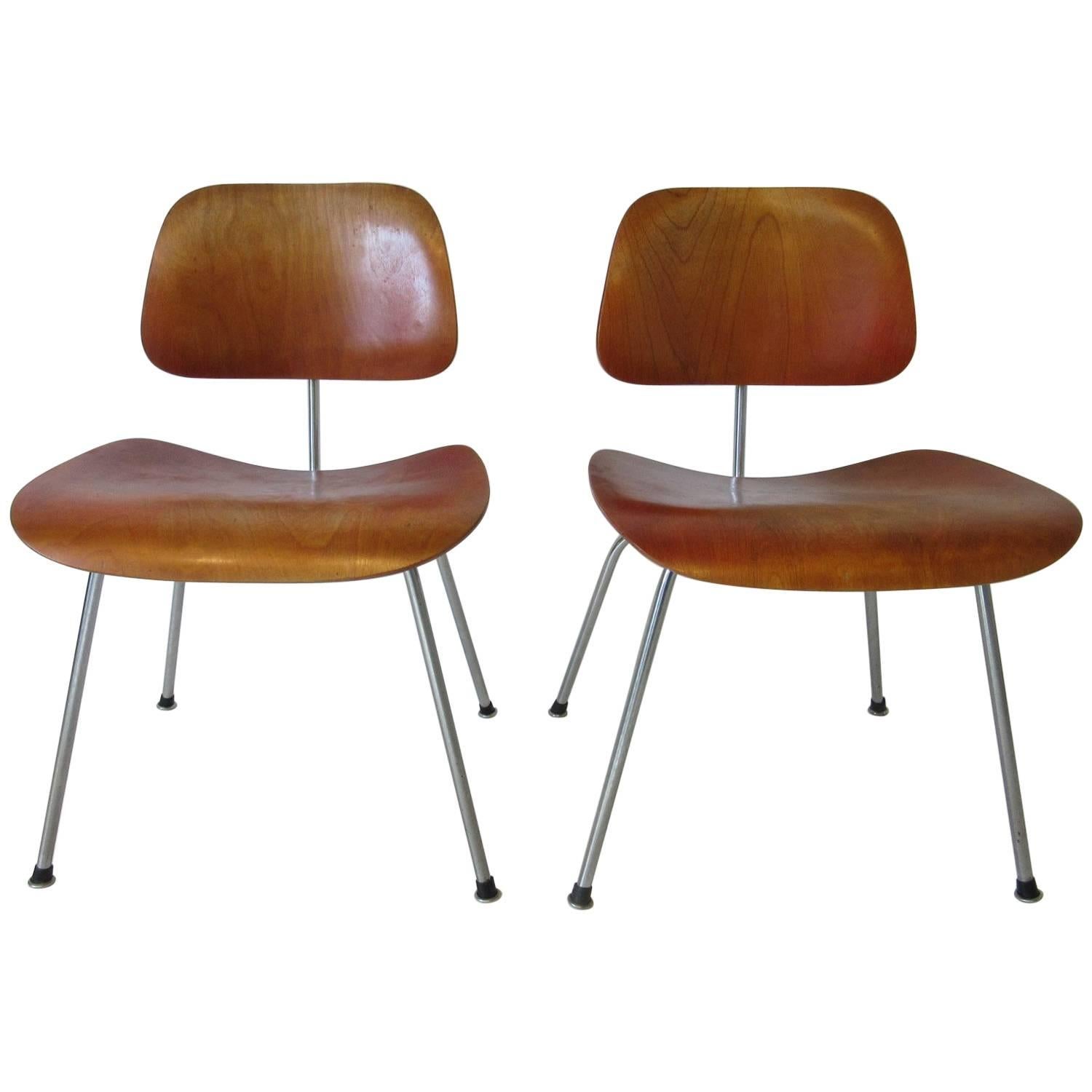 Eames Red Aniline Dyed DCM Chairs by Herman Miller