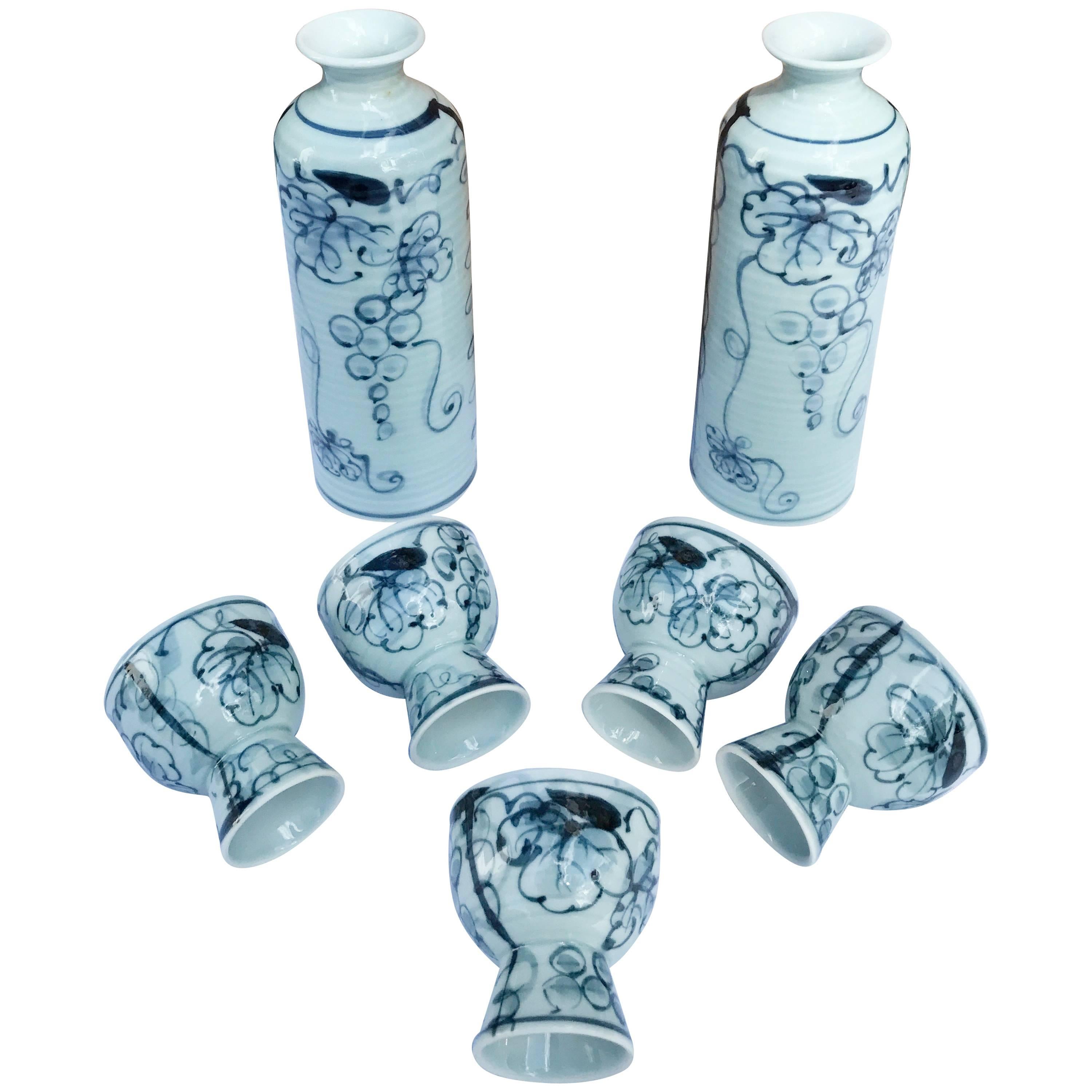 Mint, signed and boxed

Japan, a good blue and white porcelain sake service for five in an attractive grape and leaf pattern. Immediately usable.

Plus you also receive the original signed collector wooden box tomobako. 

This is a complete Japanese