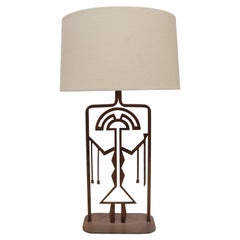 Rust Finished Metal Lamp with Symbolic Figure