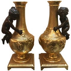 Diminutive Pair of French Gilt and Patinated Bronze Urns