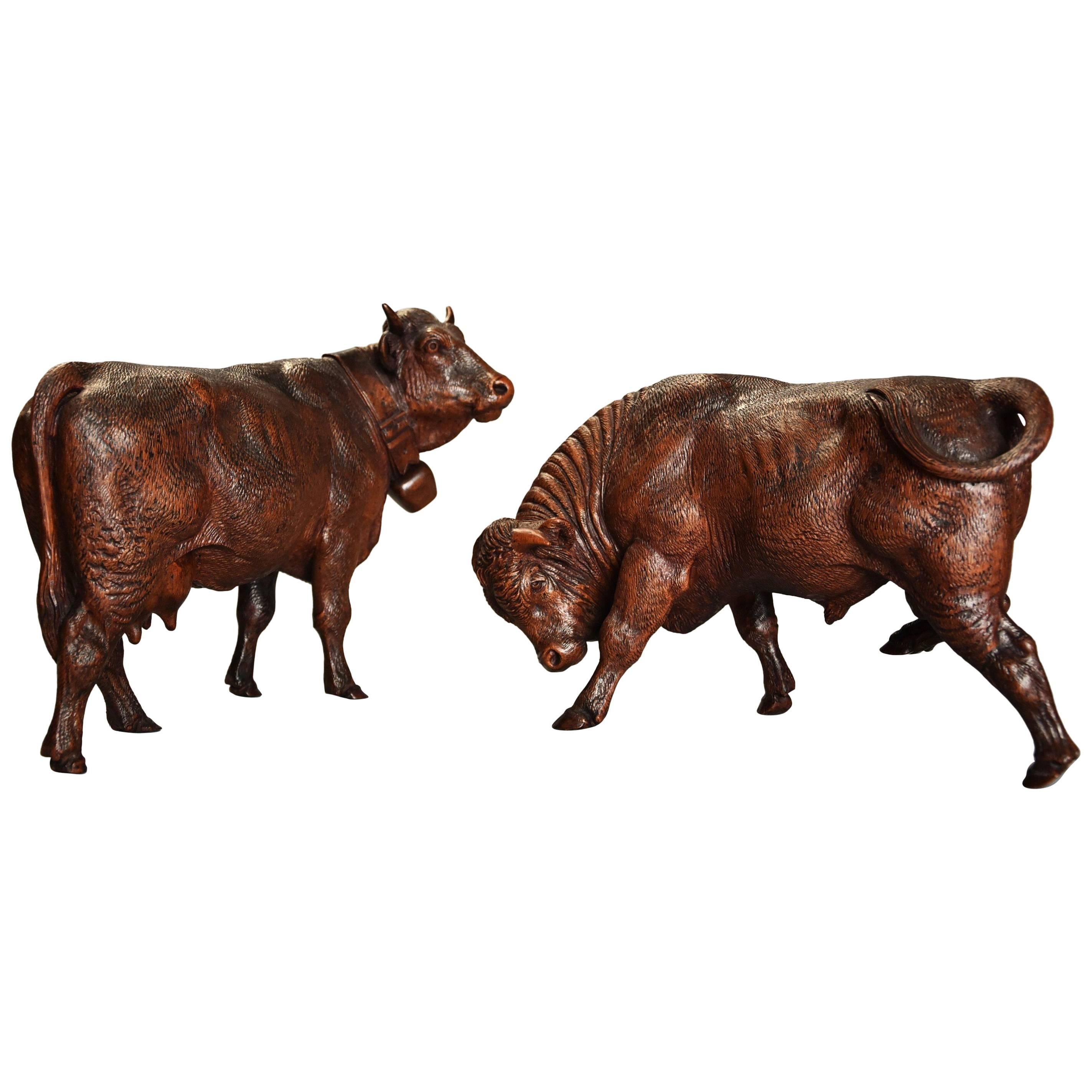 Pair of 19th Century Finely Carved Linden Wood Black Forest Cows, by Huggler For Sale