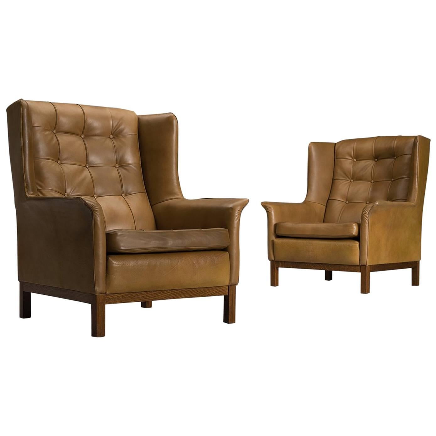 Arne Norell Matching Pair of High Back Chairs in Patinated Cognac Leather