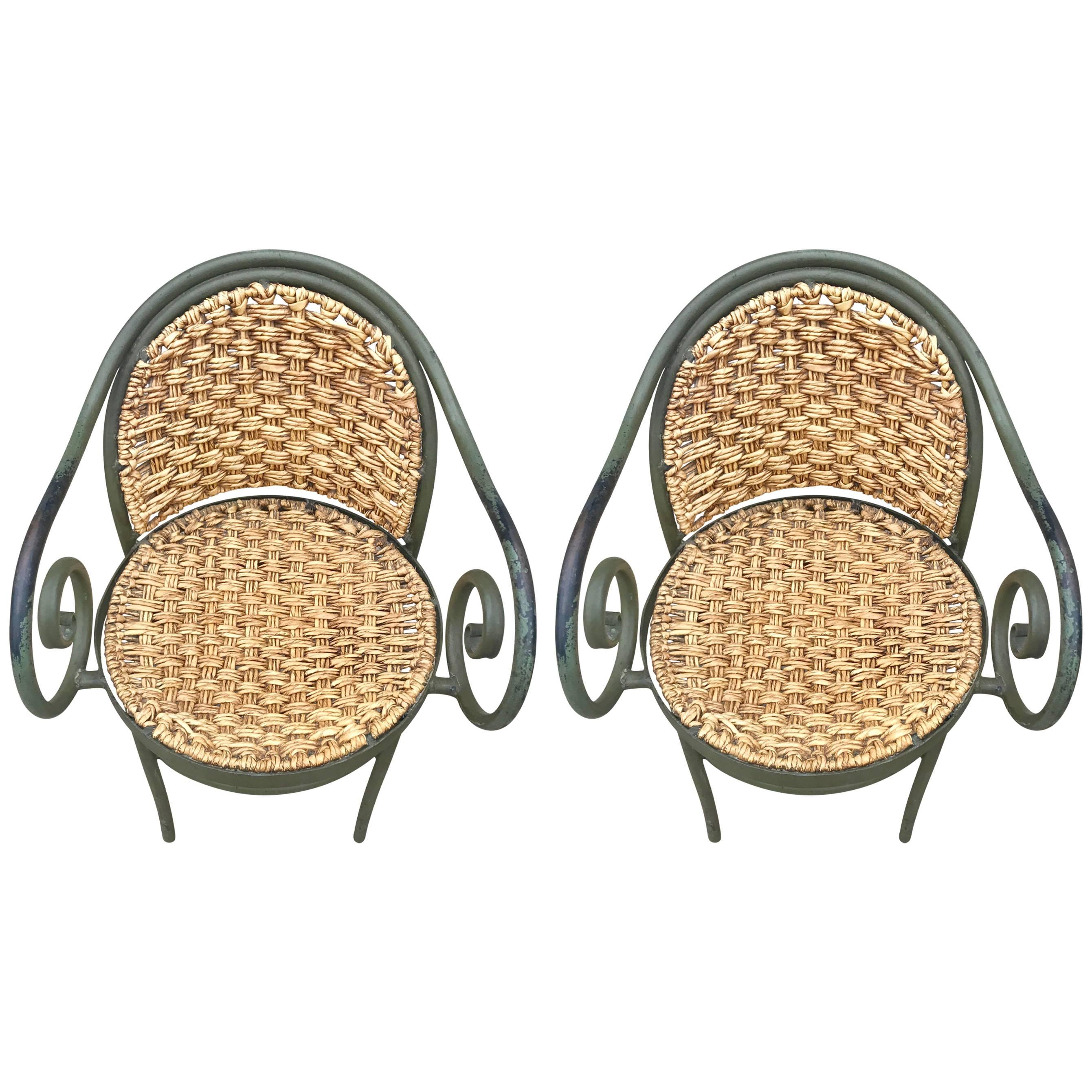 Chic pair of 1950s French wrought iron and woven rush chairs in the style of Thonet.