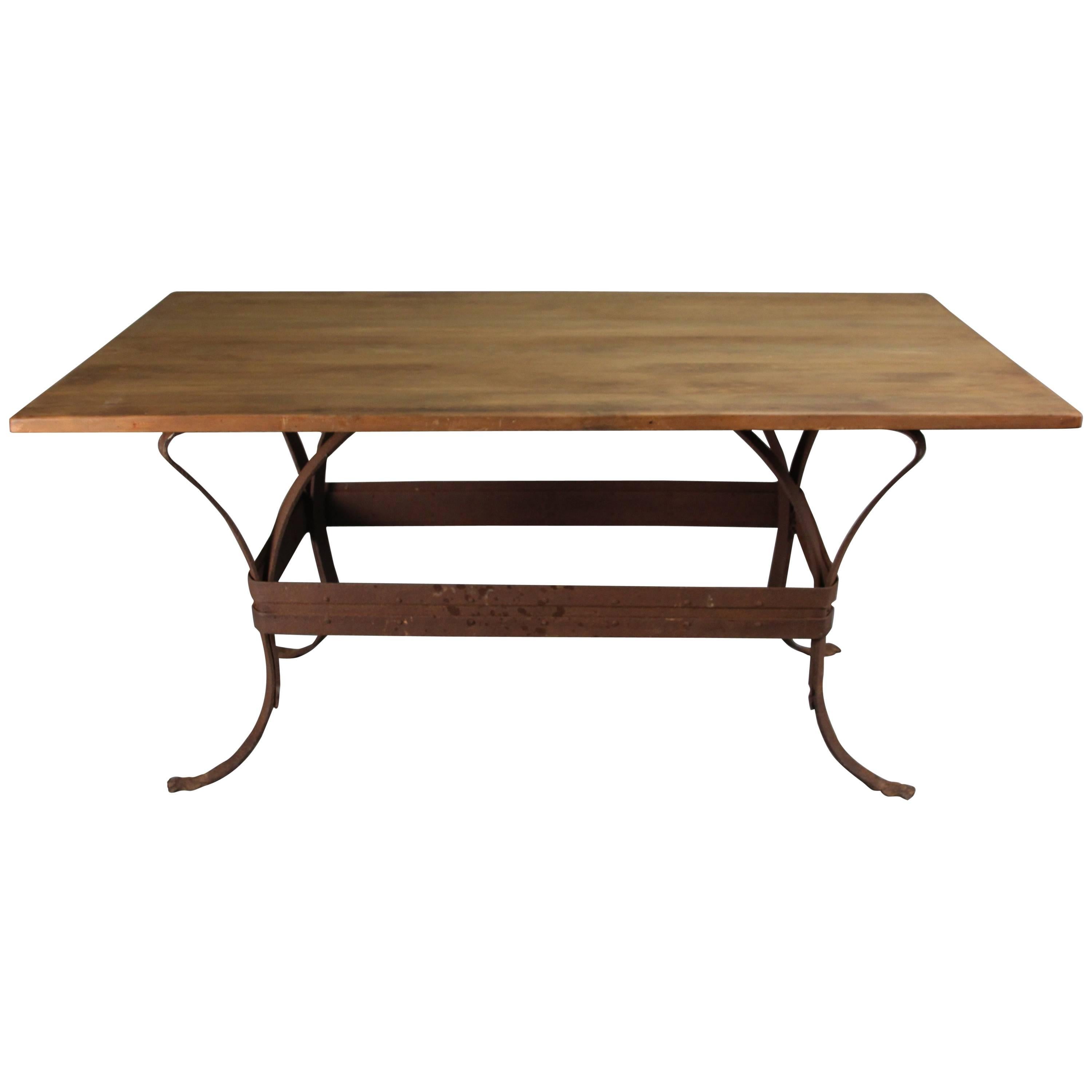 Antique Rustic Iron Table with Salvaged Top and Riveted Construction For Sale
