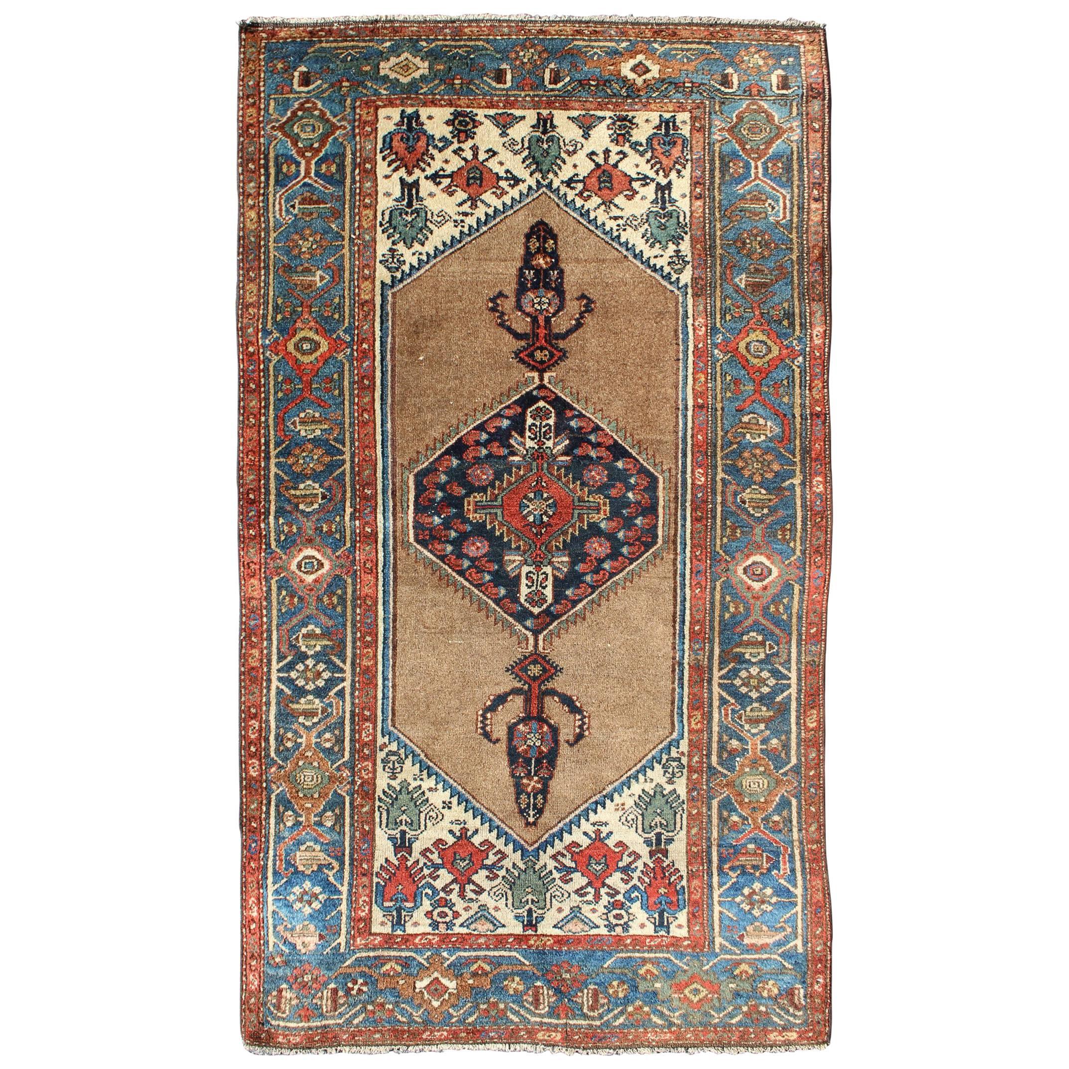 Antique Persian Serab Rug with Stretched Tribal Medallion in Camel, Blue & Ivory For Sale