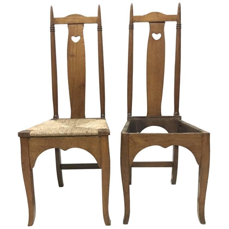 Shapland & Petter a Pair of Arts & Crafts Oak Dining Chairs with Pierced Hearts For Sale
