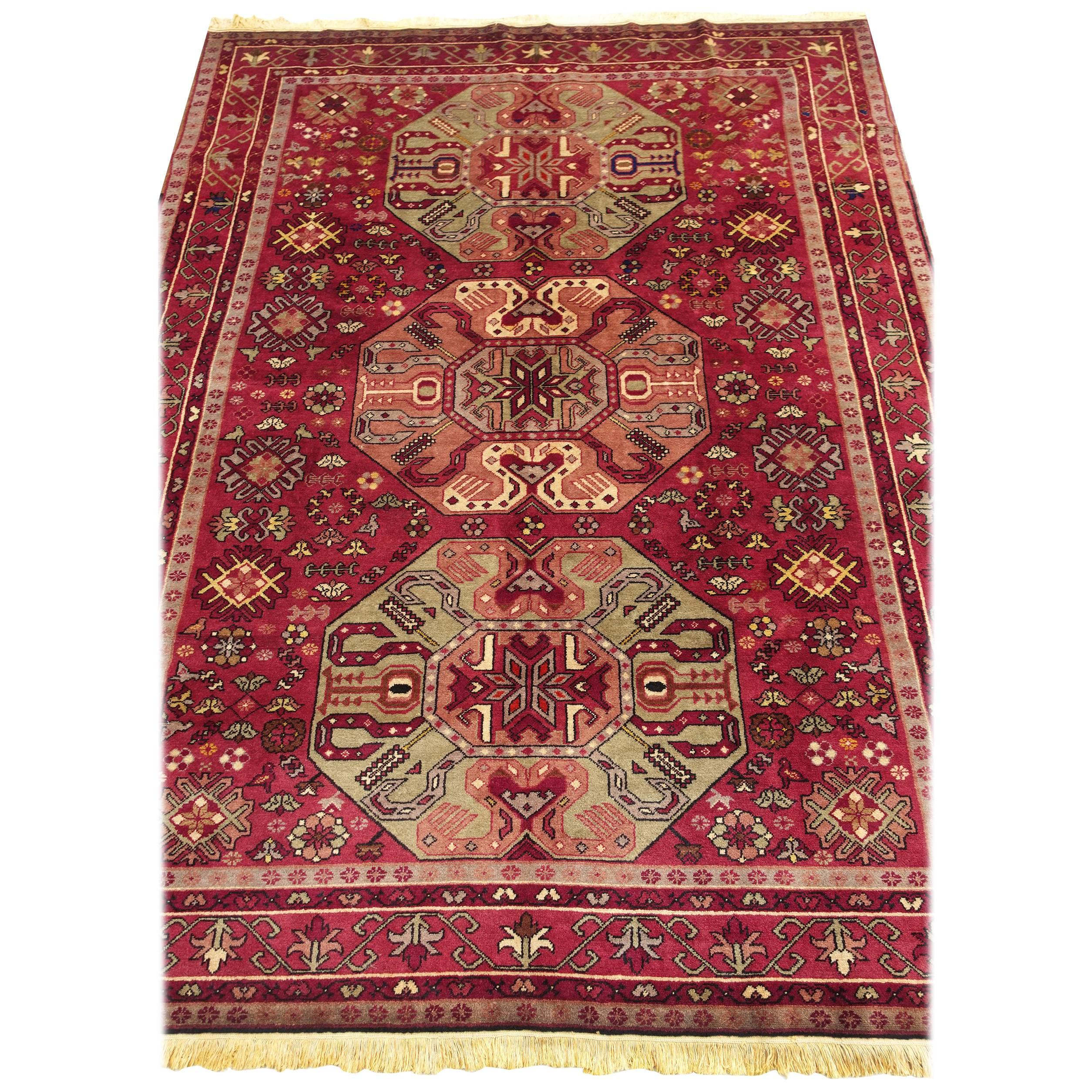 This is a beautiful Kazak rug from Armenia dating back to mid- or second half of the 20th century. It is a very fine rug in wool on rusty cotton foundation.
Stylistically, it is a Kazak emulating the style of Armenian orphan rugs. The colors, the